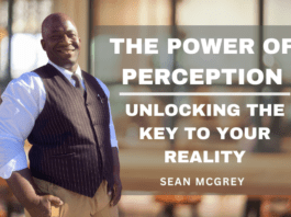 Smiling man standing with text about perception and reality.